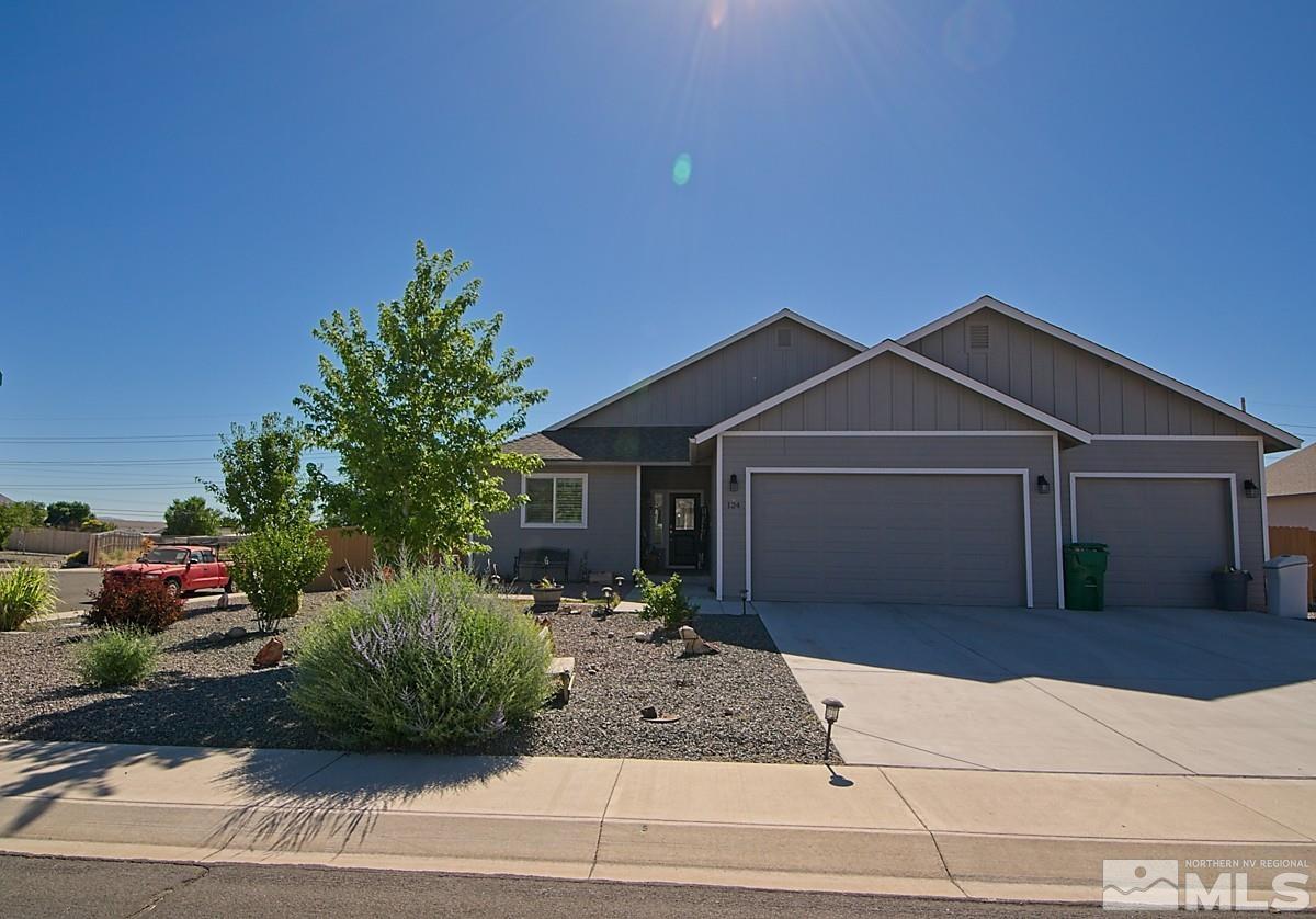 a front view of a house with garage