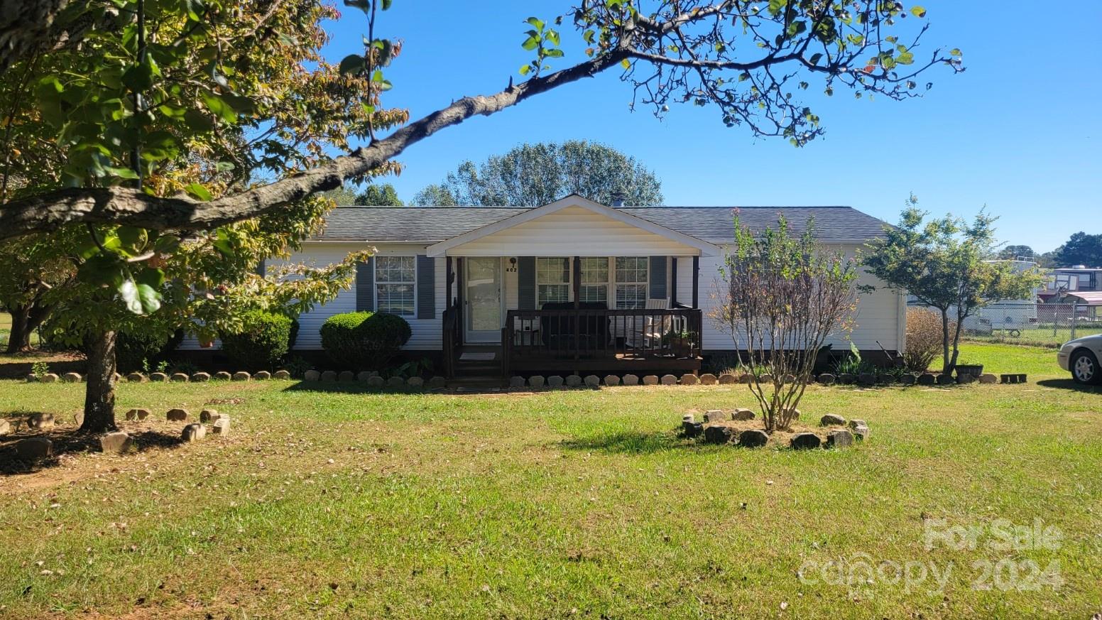 a view of a house with a yard