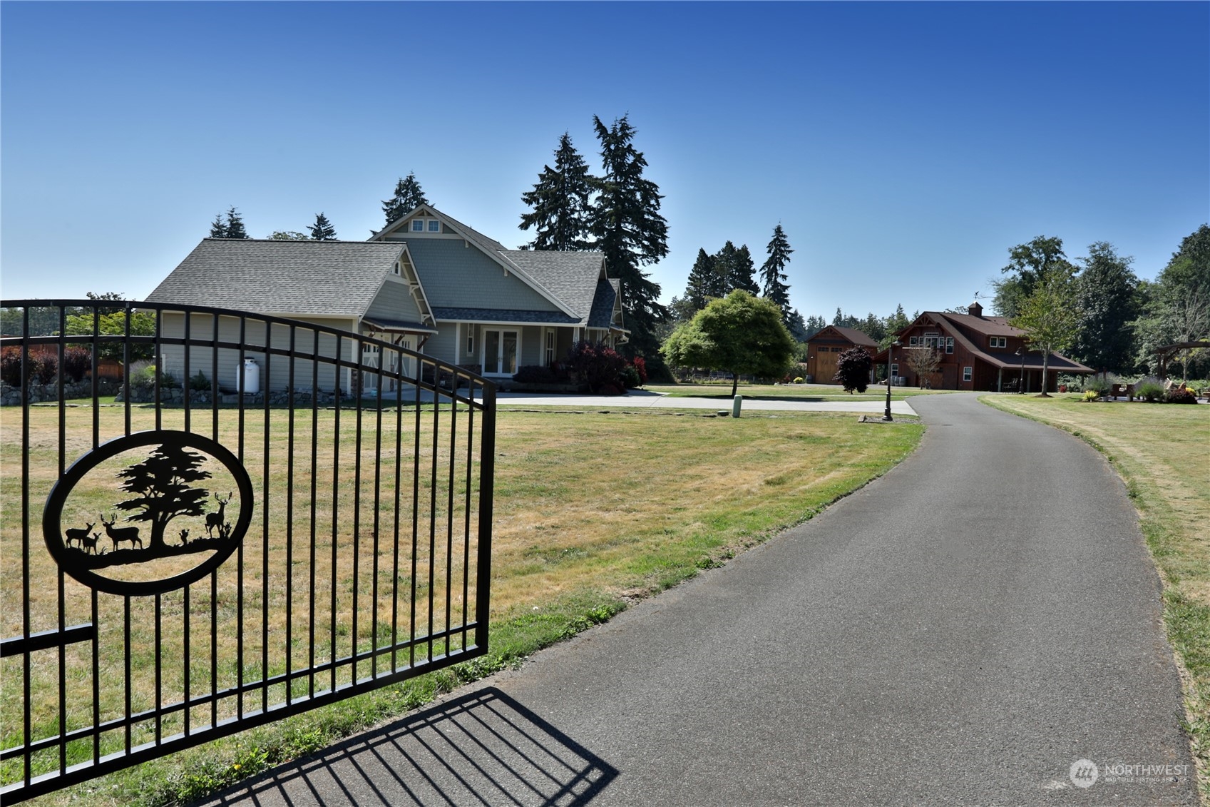 a view of a house with a swimming pool and a yard