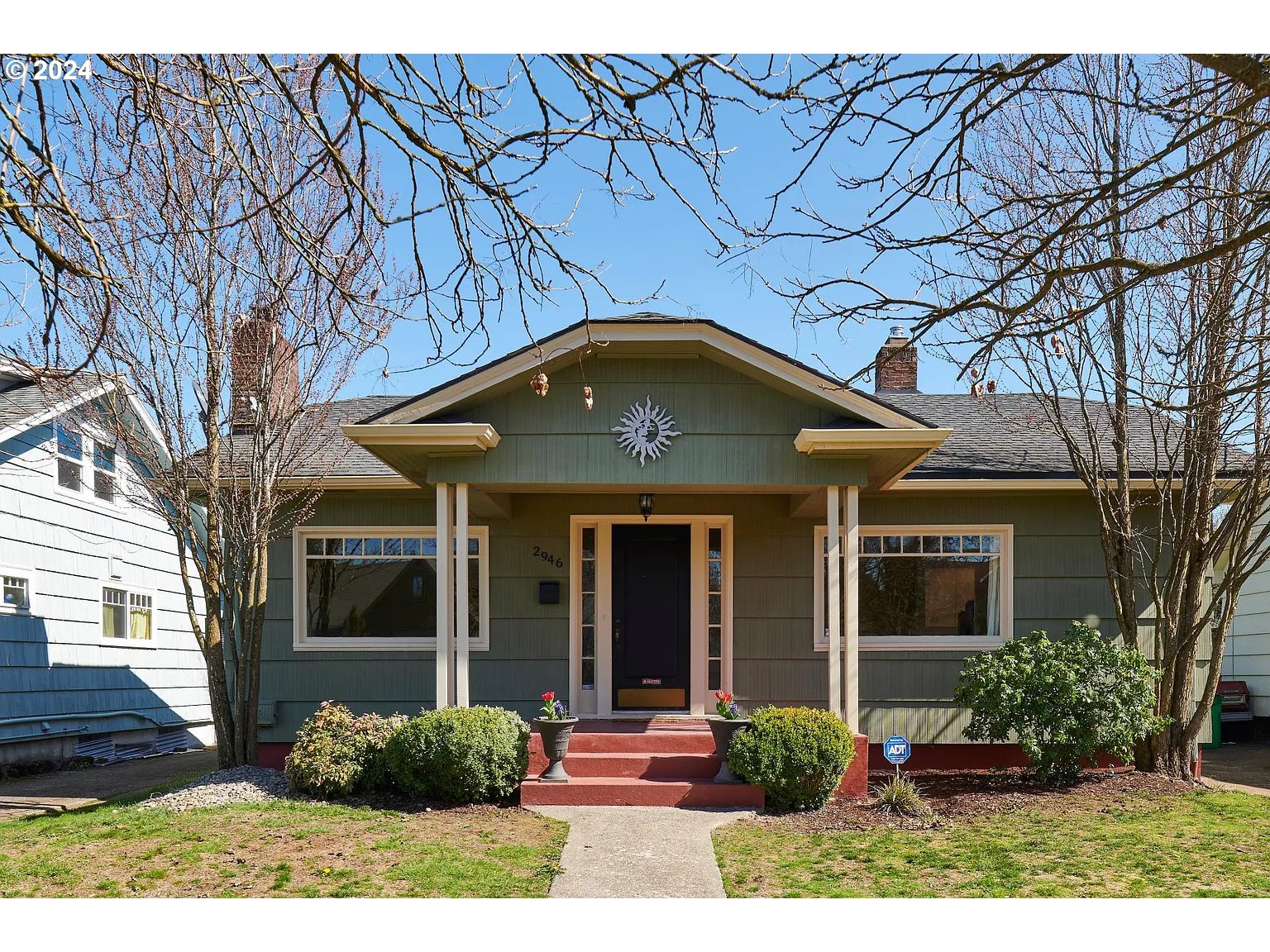 a front view of a house with garden