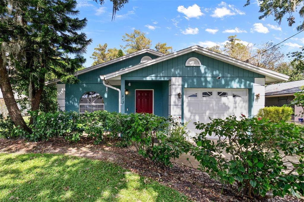 a front view of a house with garden