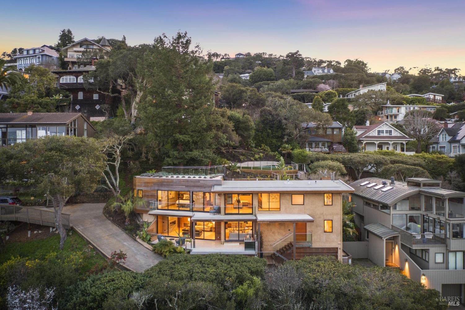 an aerial view of a house with a yard