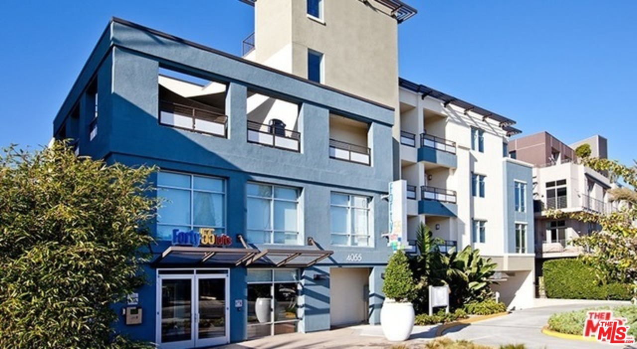 a front view of residential houses and street