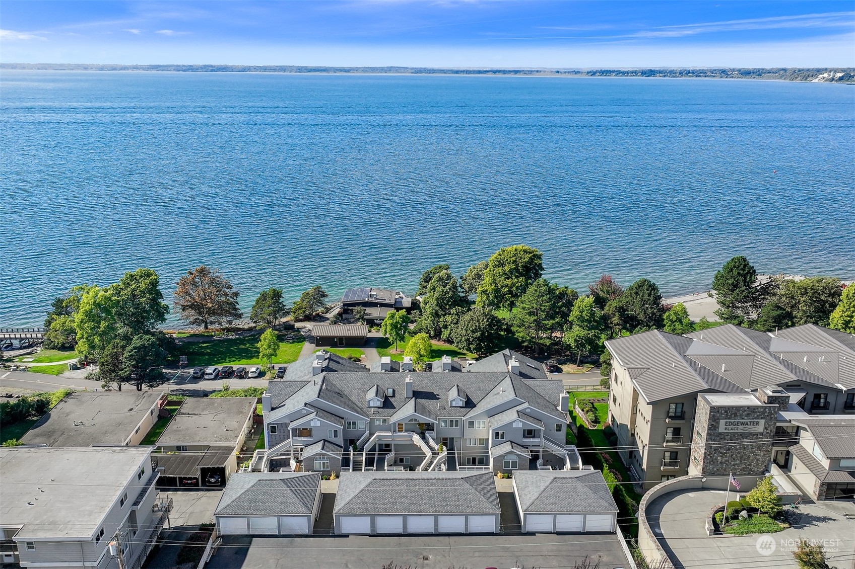 an aerial view of a house with a ocean view