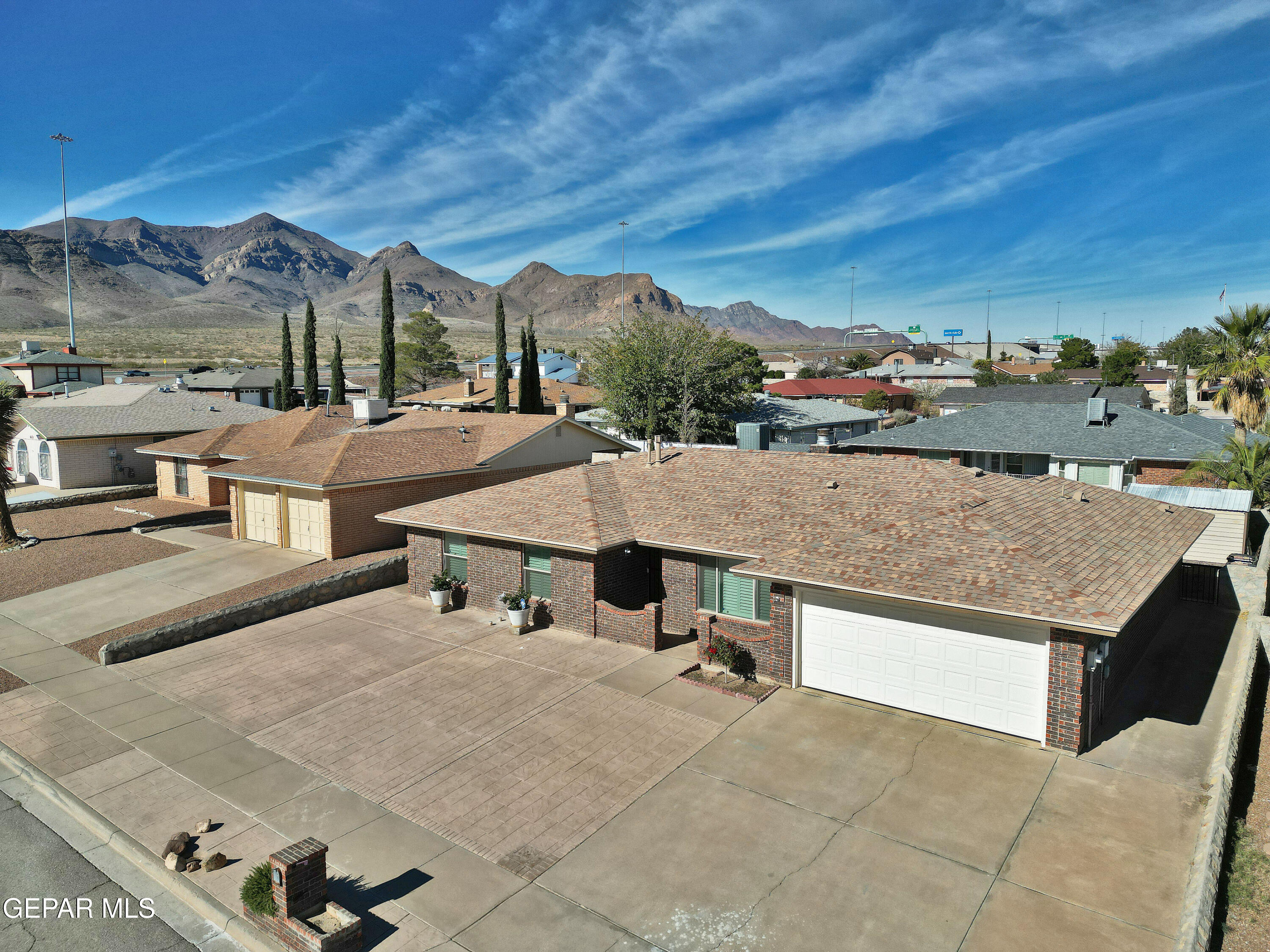 an aerial view of a house with a mountain view