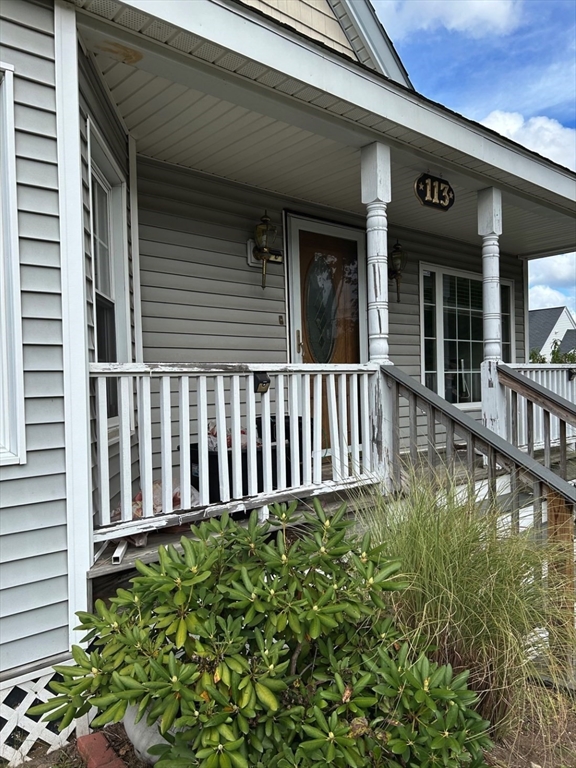 a view of a house with porch and wooden floor