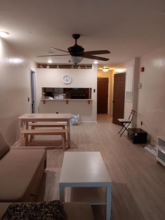 a room with gym equipment and a chandelier