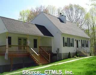 a view of house with yard