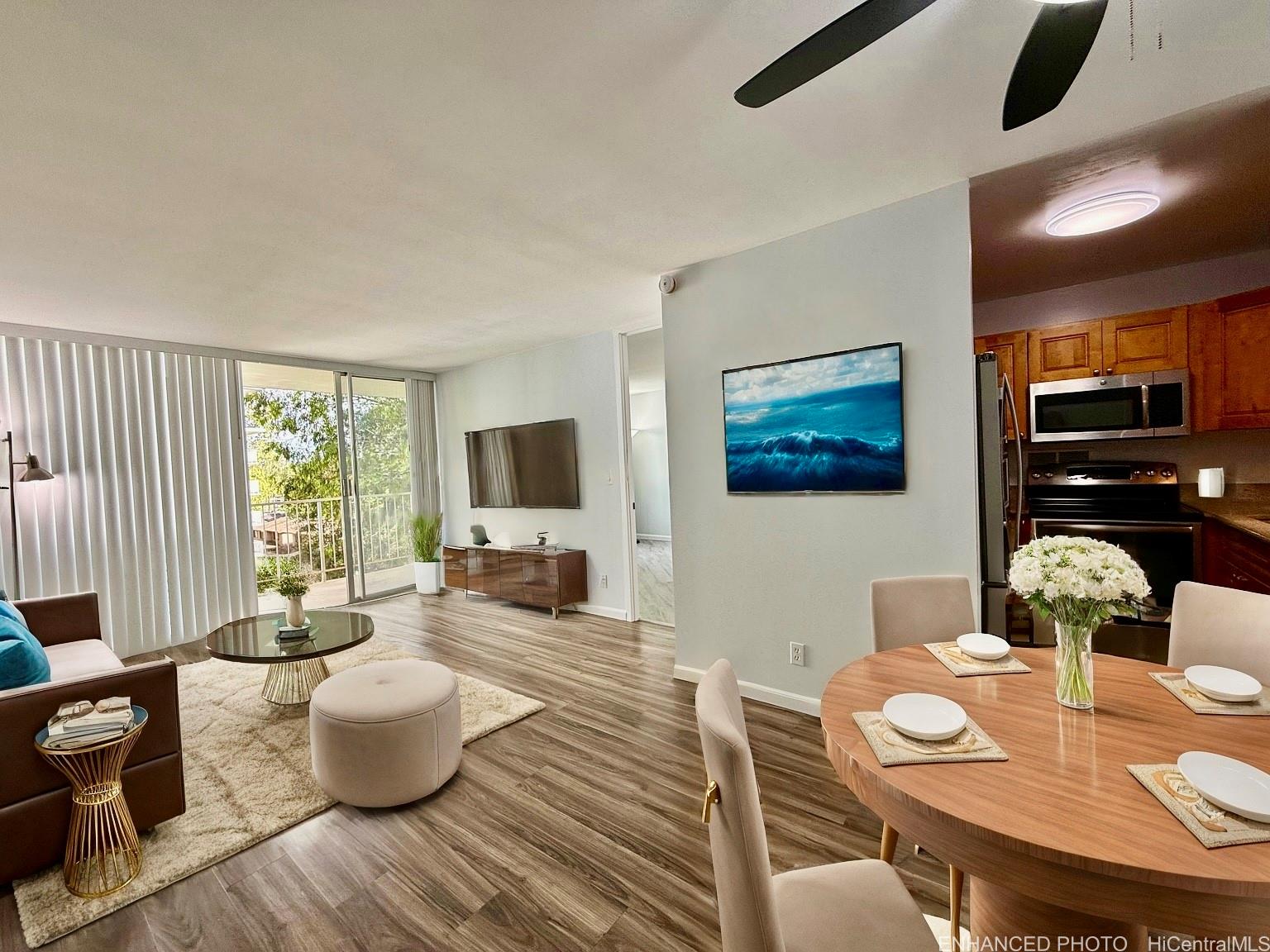 a living room with furniture and wooden floor