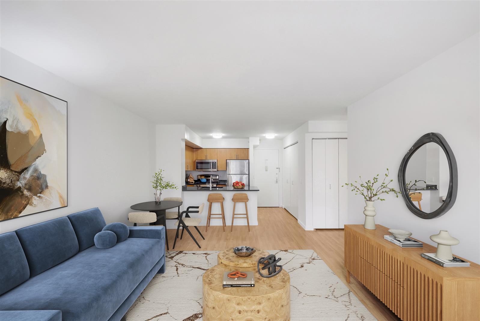 a living room with furniture a mirror and a flat screen tv