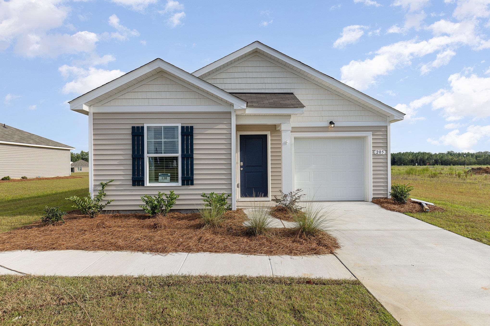 View of front of property featuring a front lawn a