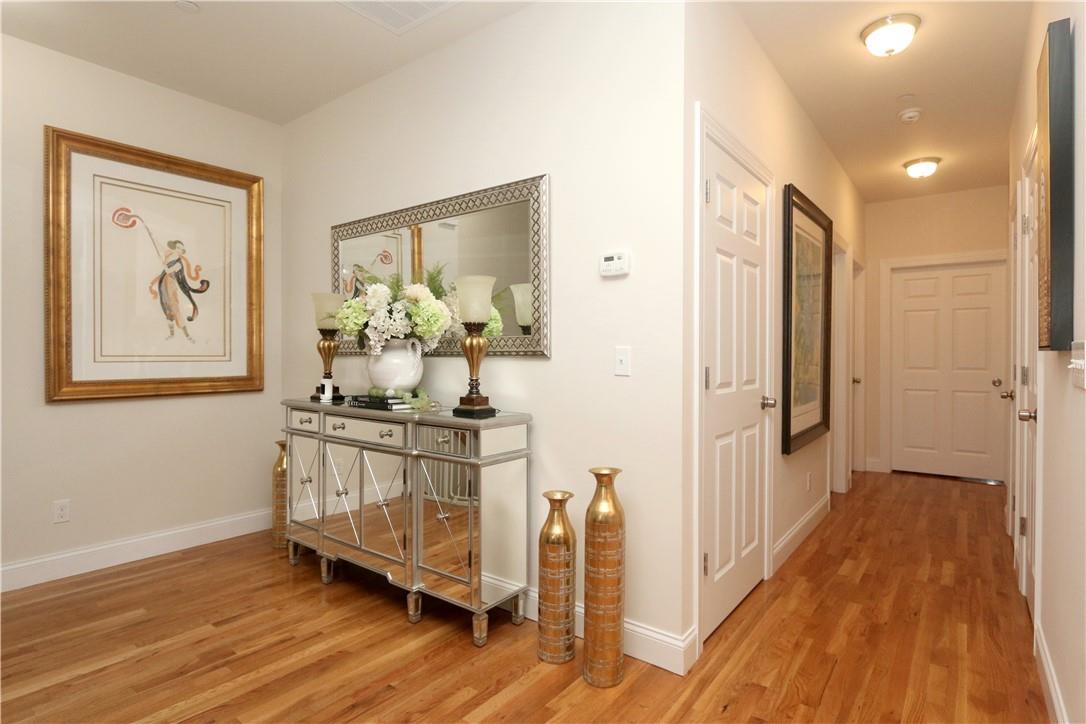 a view of a hallway and wooden floor