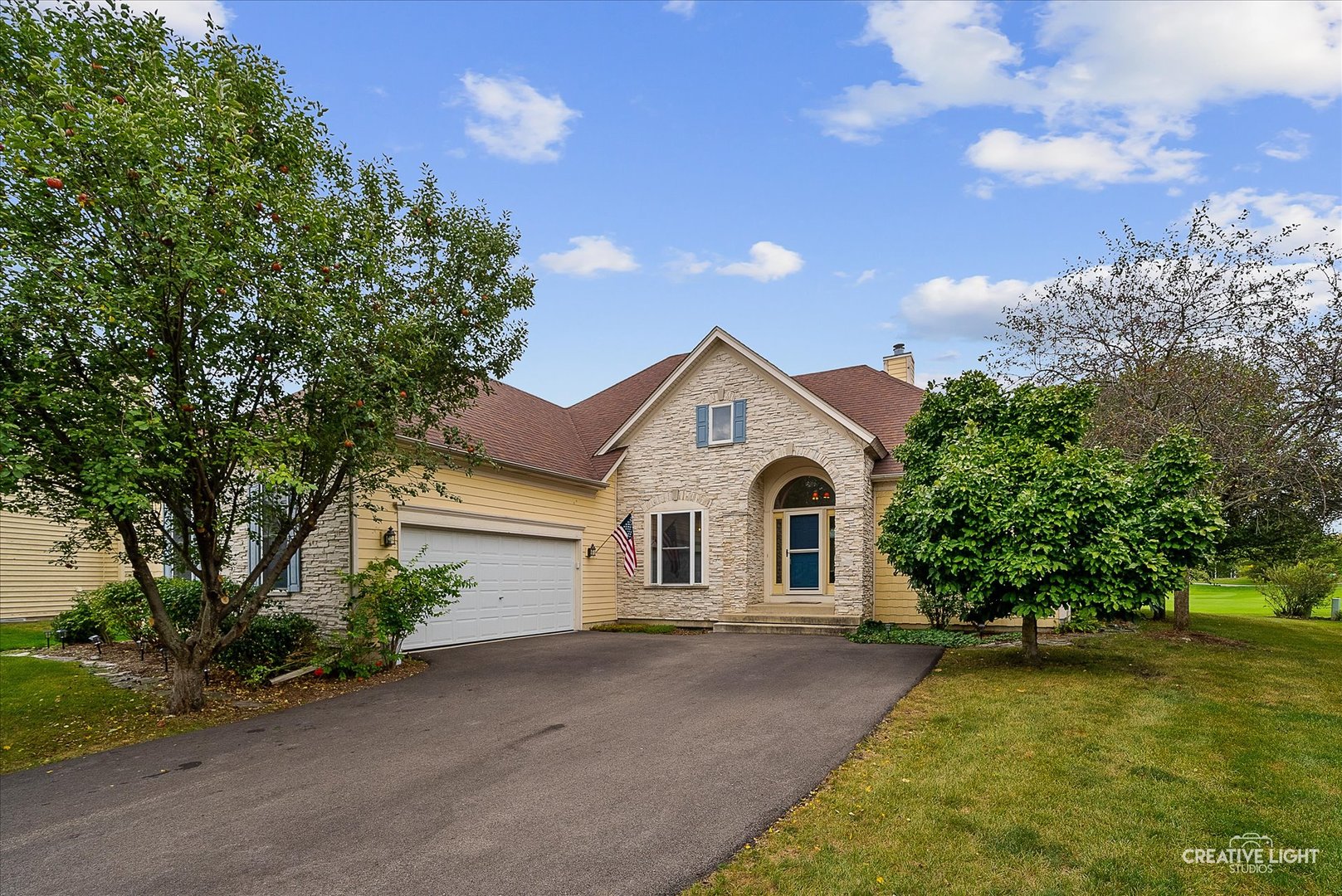 a front view of a house with garden