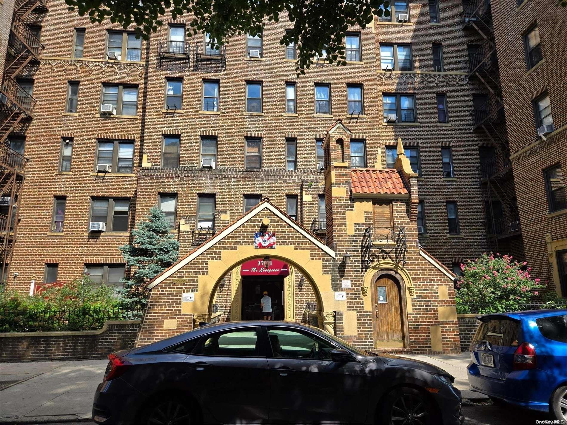 a front view of a building with parking space