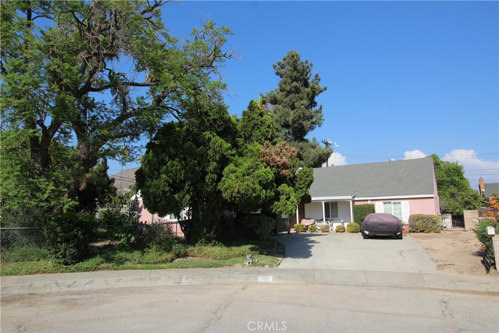 a front view of a house with a yard and a garage