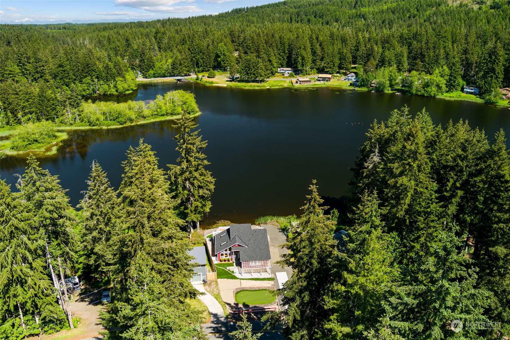 an aerial view of a house with lake view