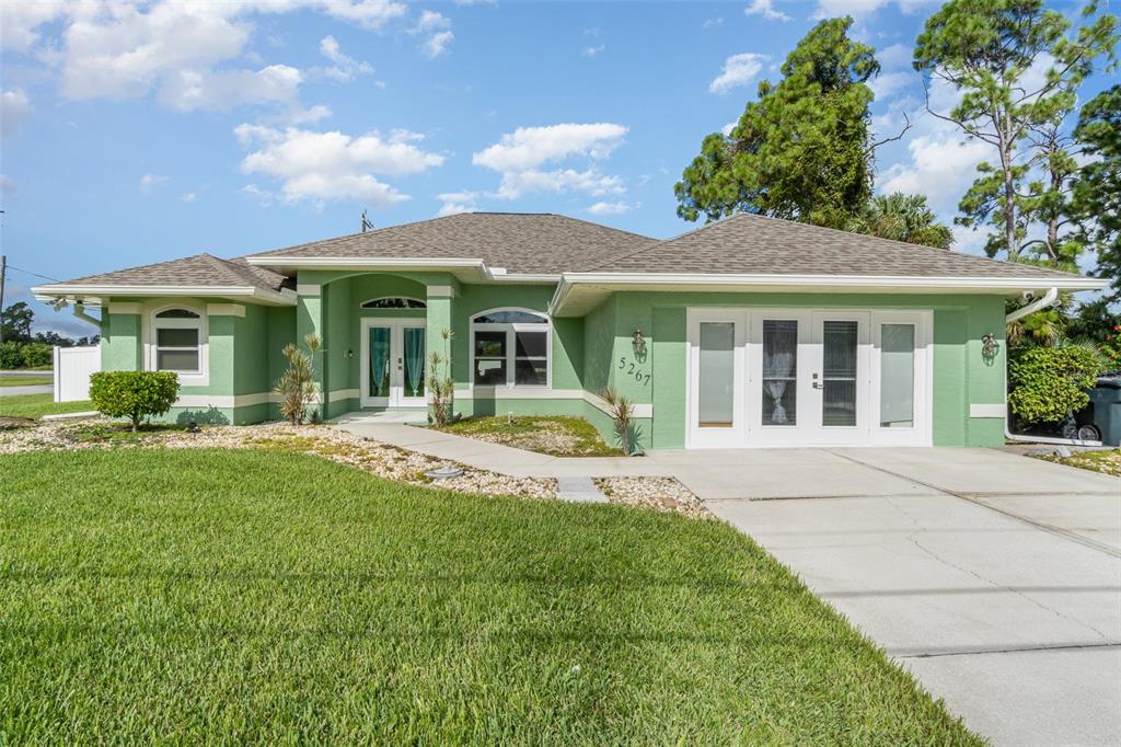 a front view of a house with a yard