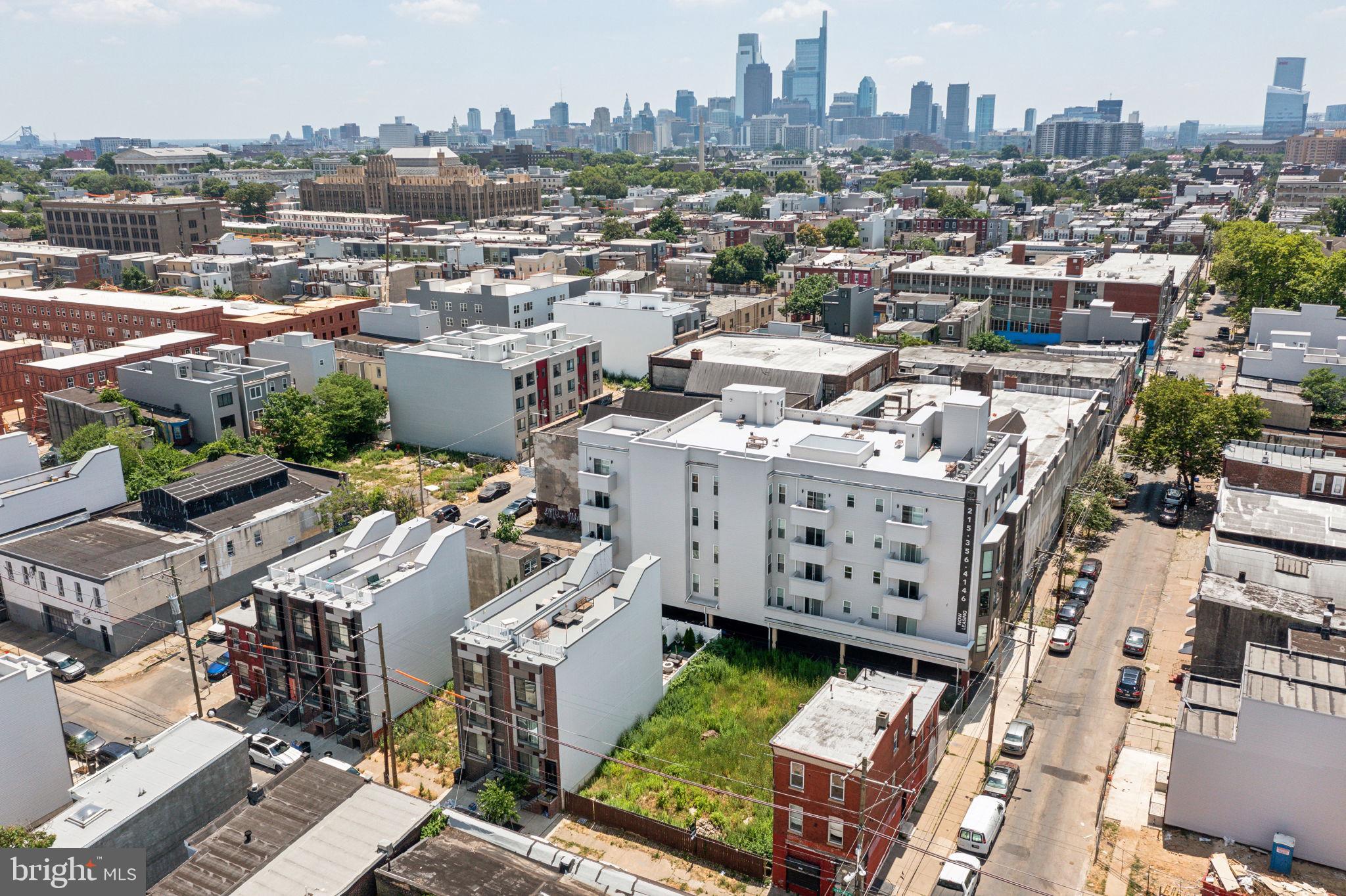 an aerial view of a city with lots of residential buildings