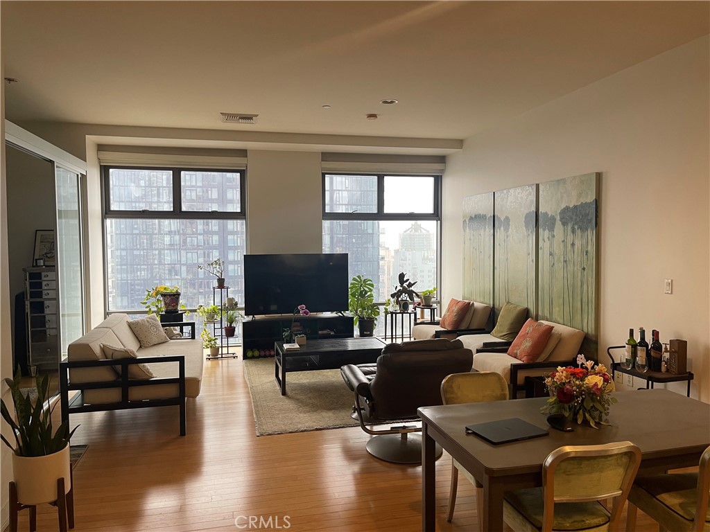 a living room with fireplace furniture and a flat screen tv