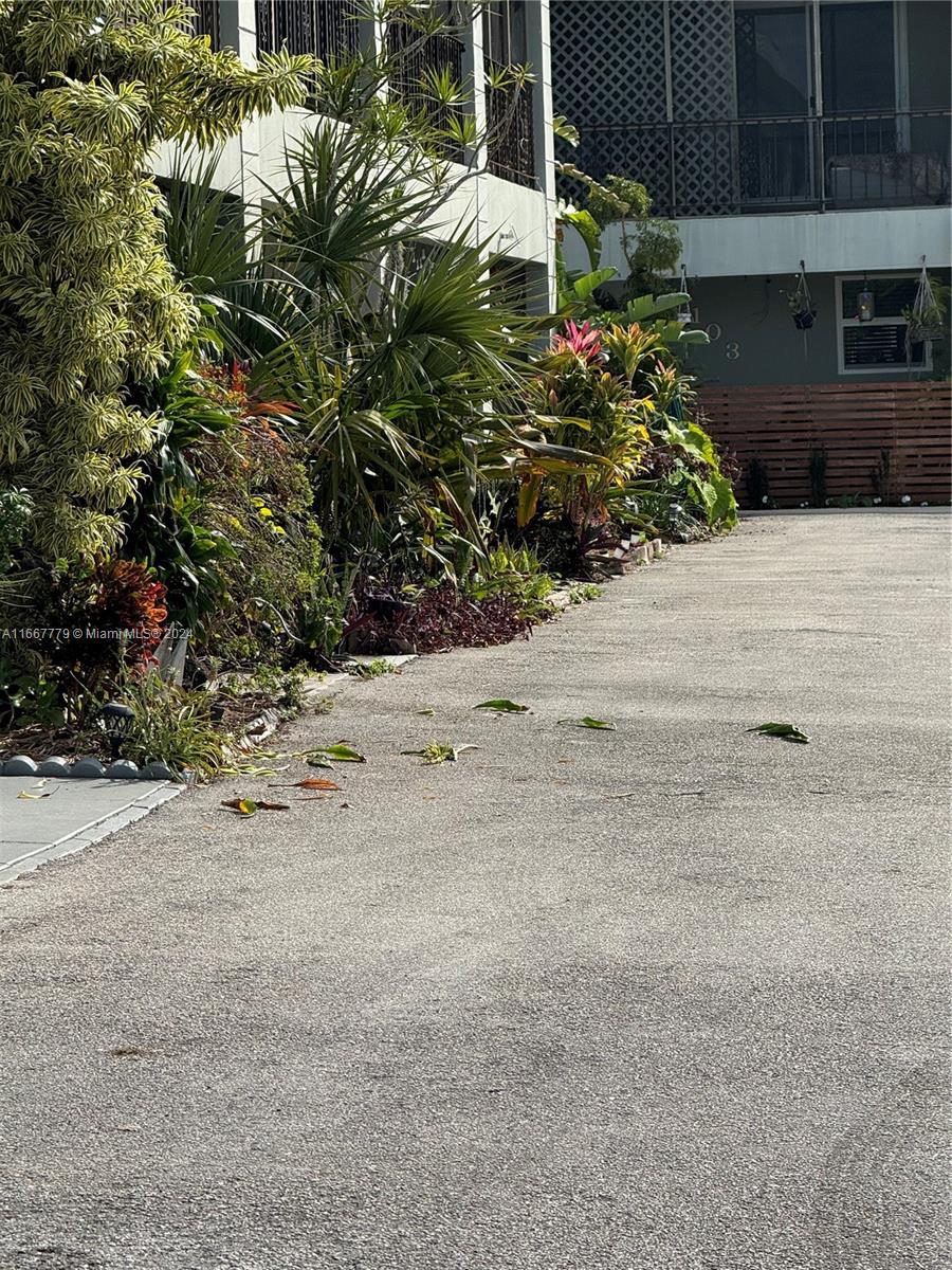 a view of a backyard of the house