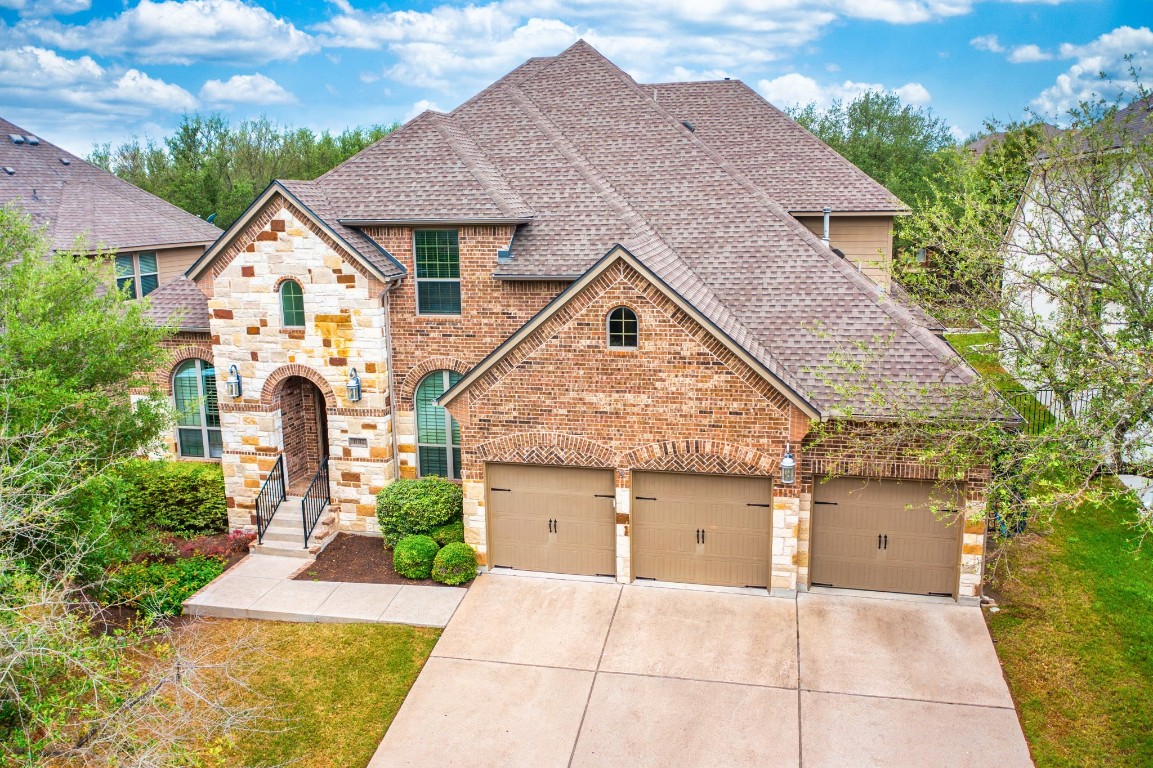 a aerial view of a house with a yard