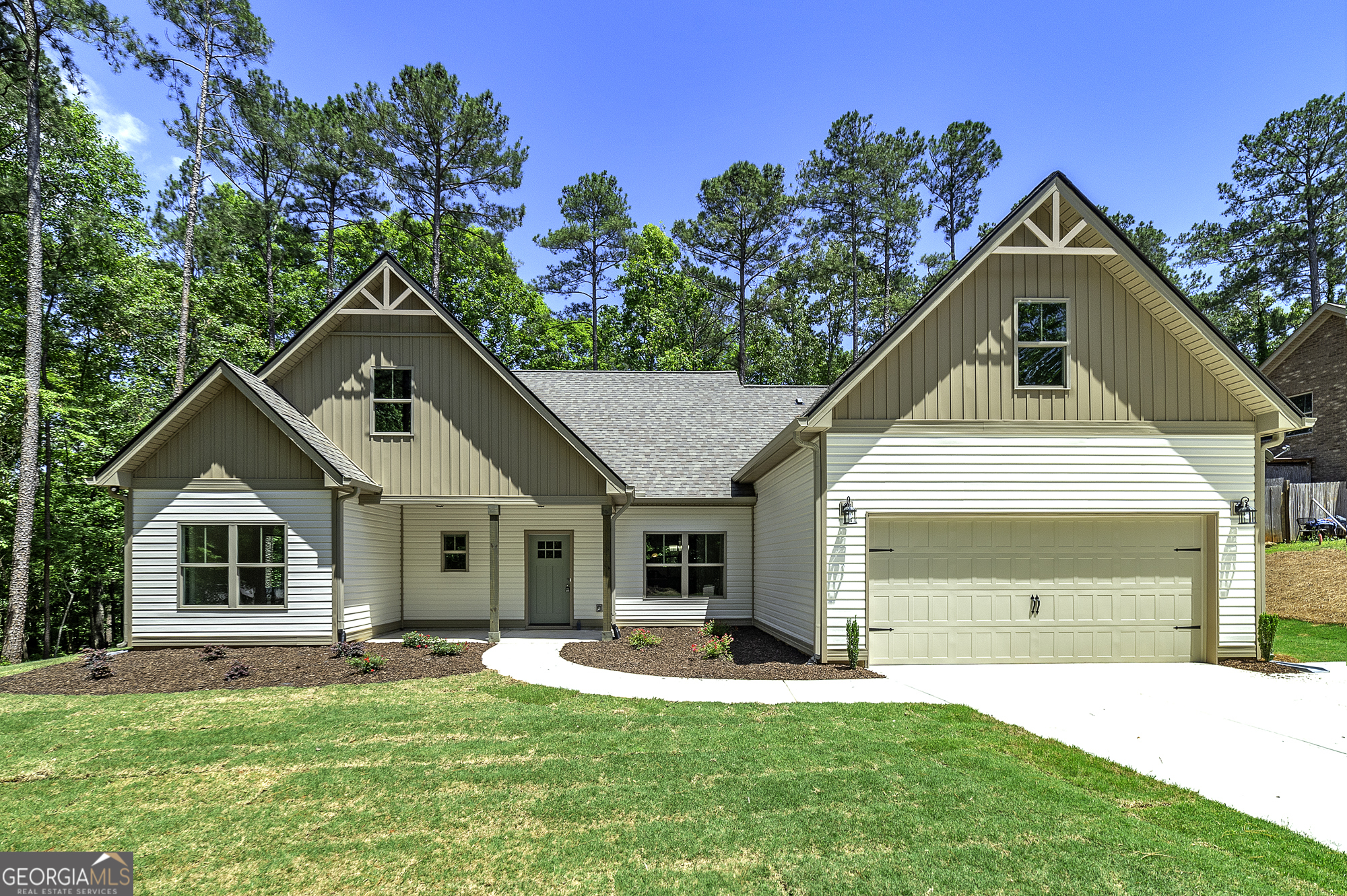 a front view of a house with a yard and porch