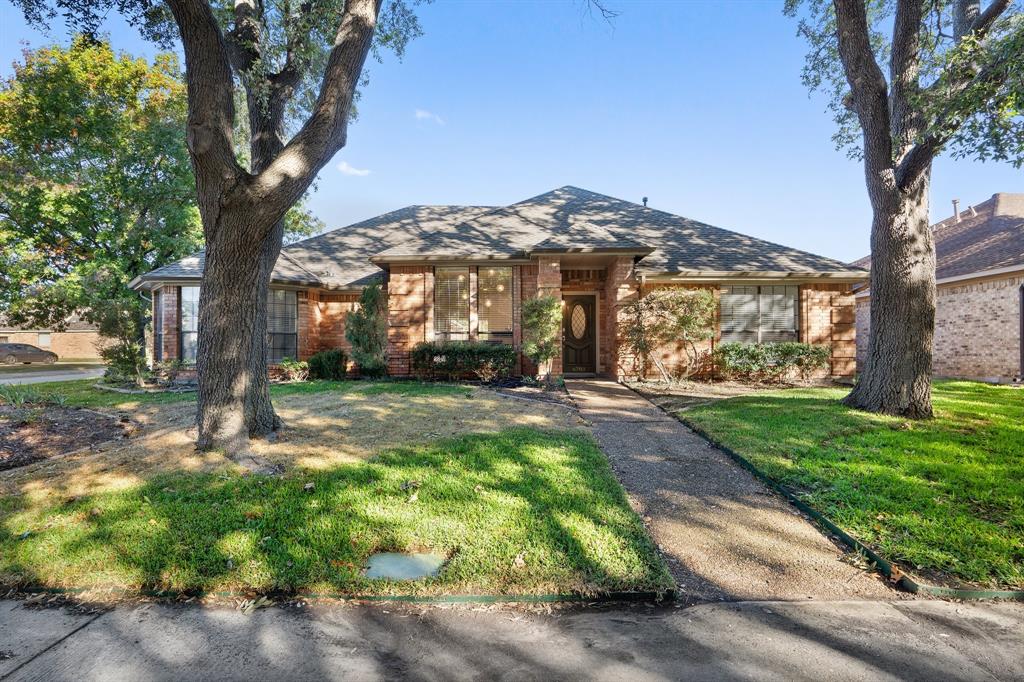 Single story home featuring a front yard