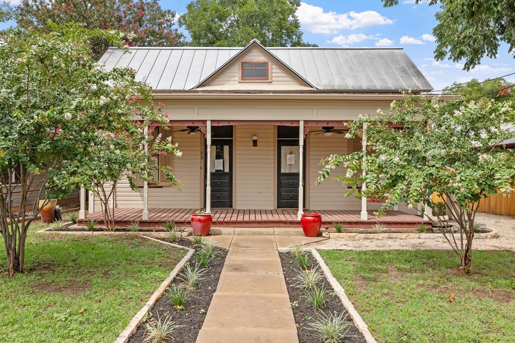 a front view of a house with a yard