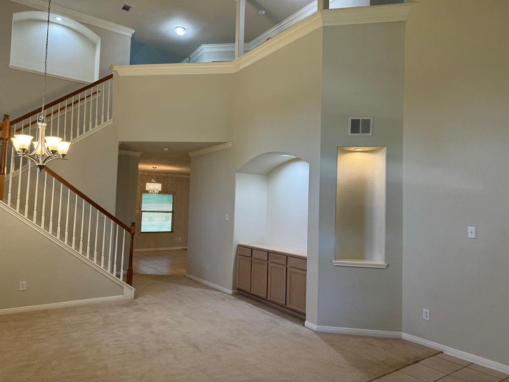 a view of a hallway with entryway door