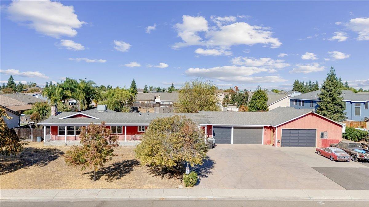 a aerial view of a house with yard and entertaining space