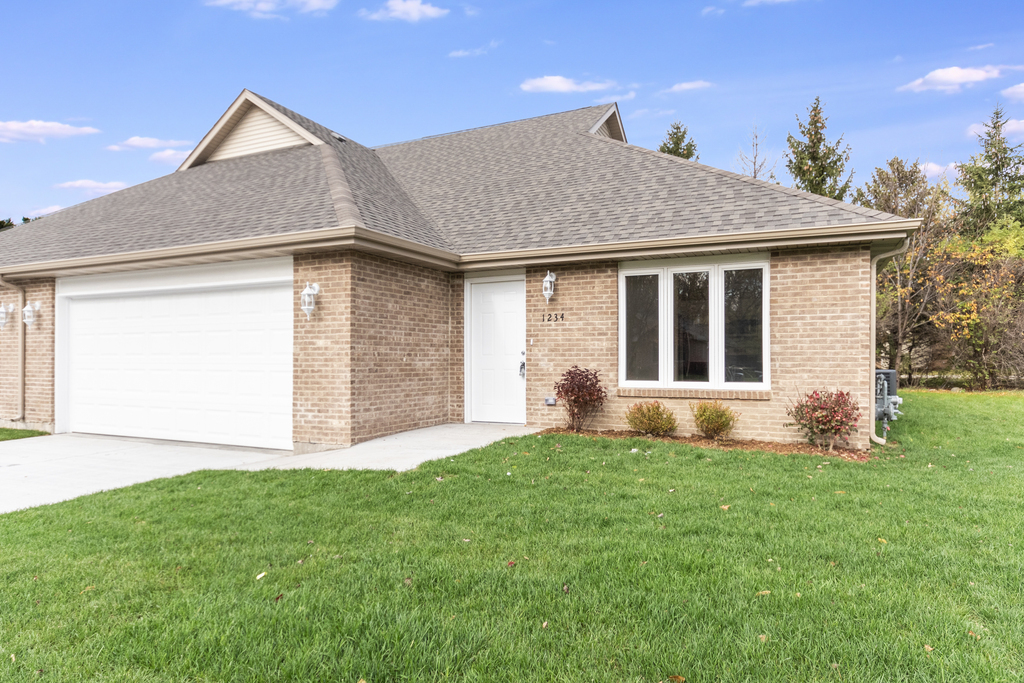 a front view of house with yard