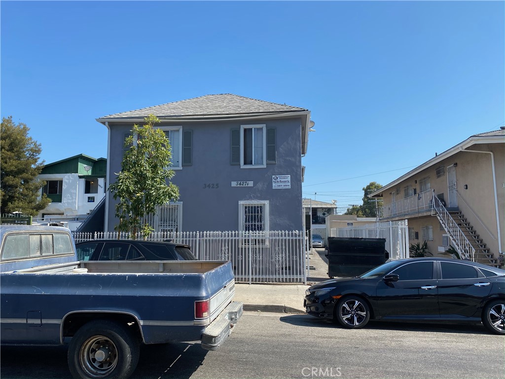 a front view of a house with parking space