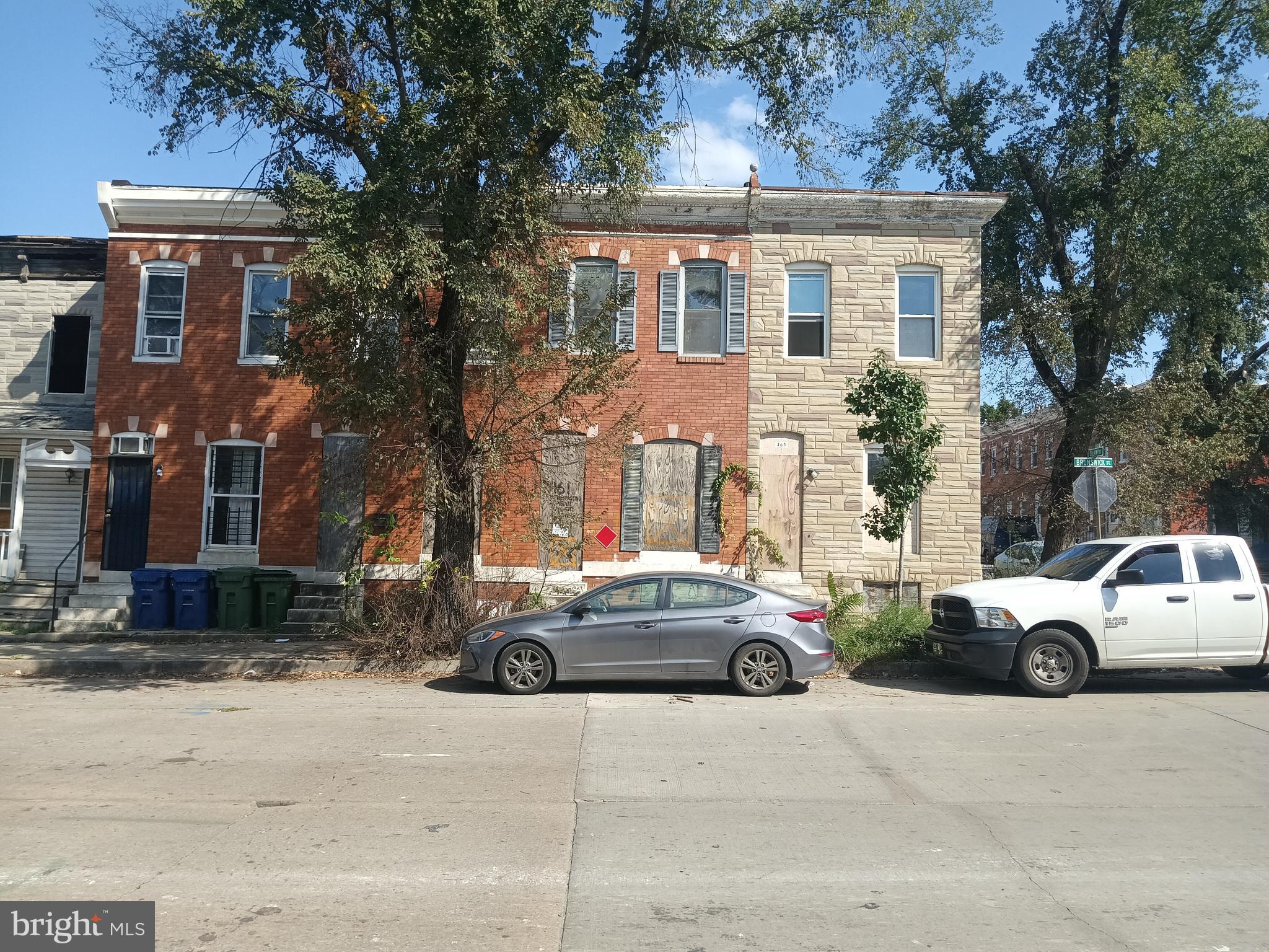 a car parked in front of a houses