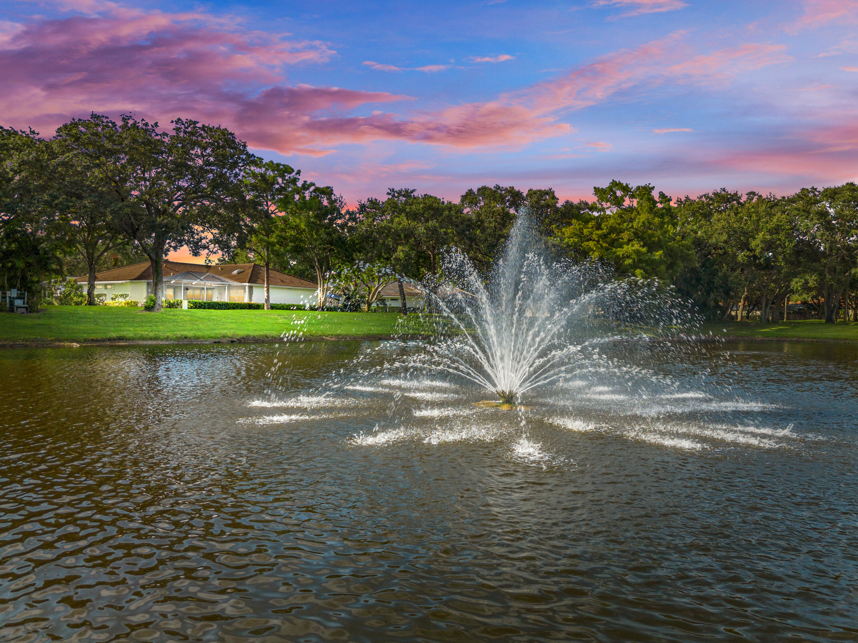 a view of a lake with a yard