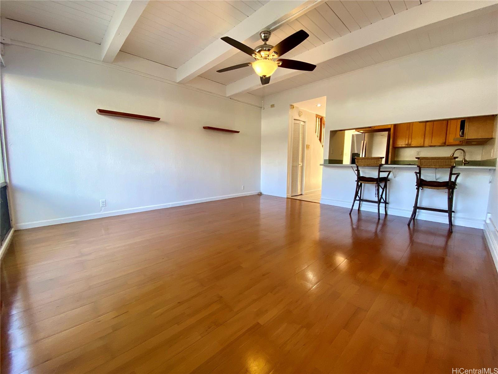 a view of livingroom with furniture and a ceiling fan