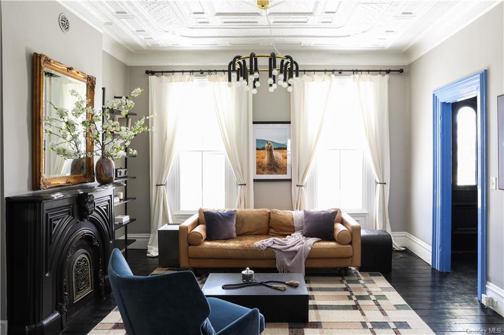 a living room with furniture and a fireplace