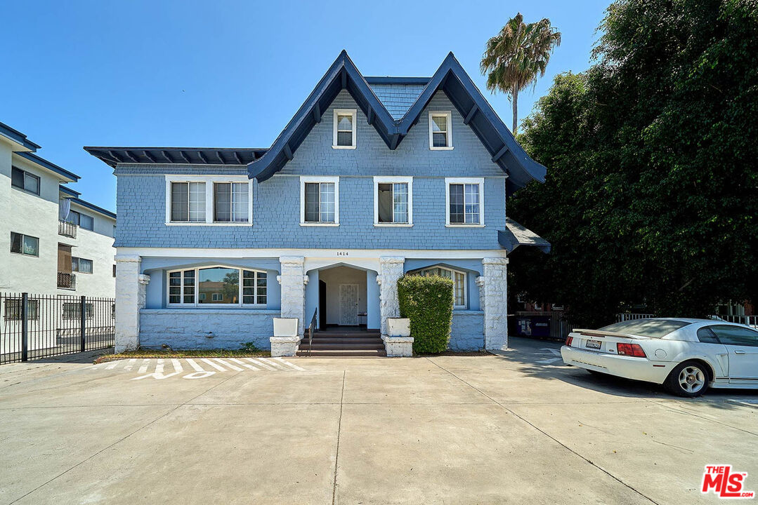 a front view of a house with parking space