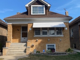 a front view of a house with a garage