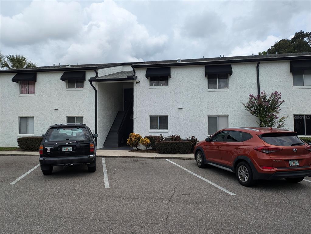 a front view of a house with parking space