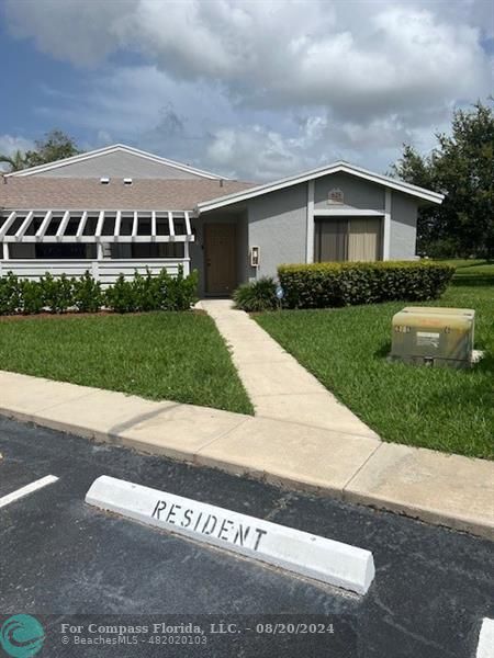 a view of house with outdoor space and yard