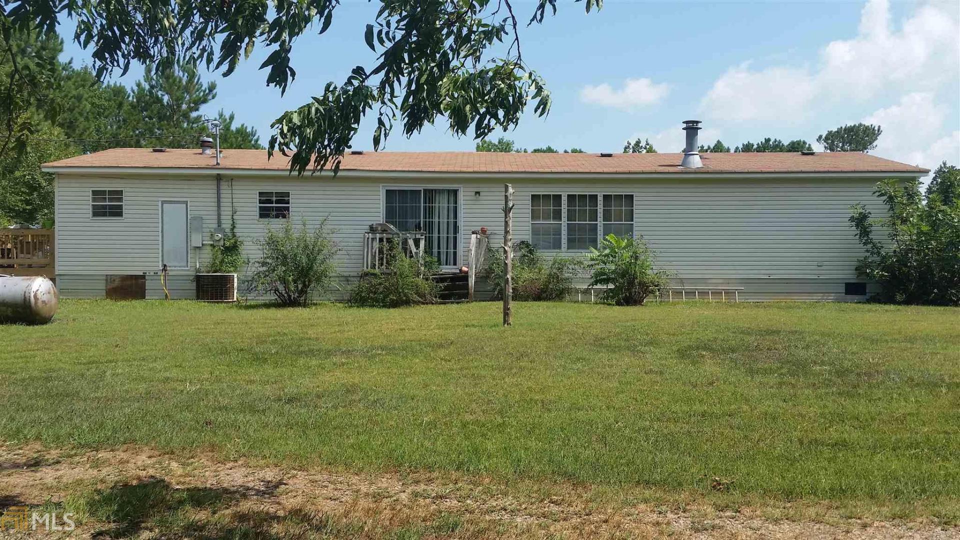 front view of a house with a garden