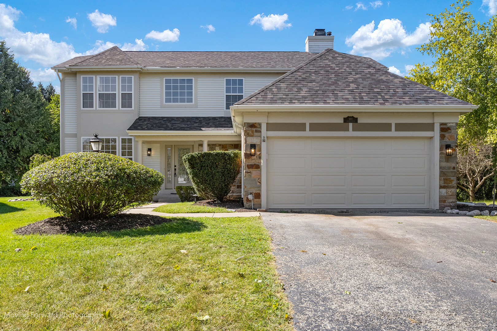 a view of a house with a yard and garage