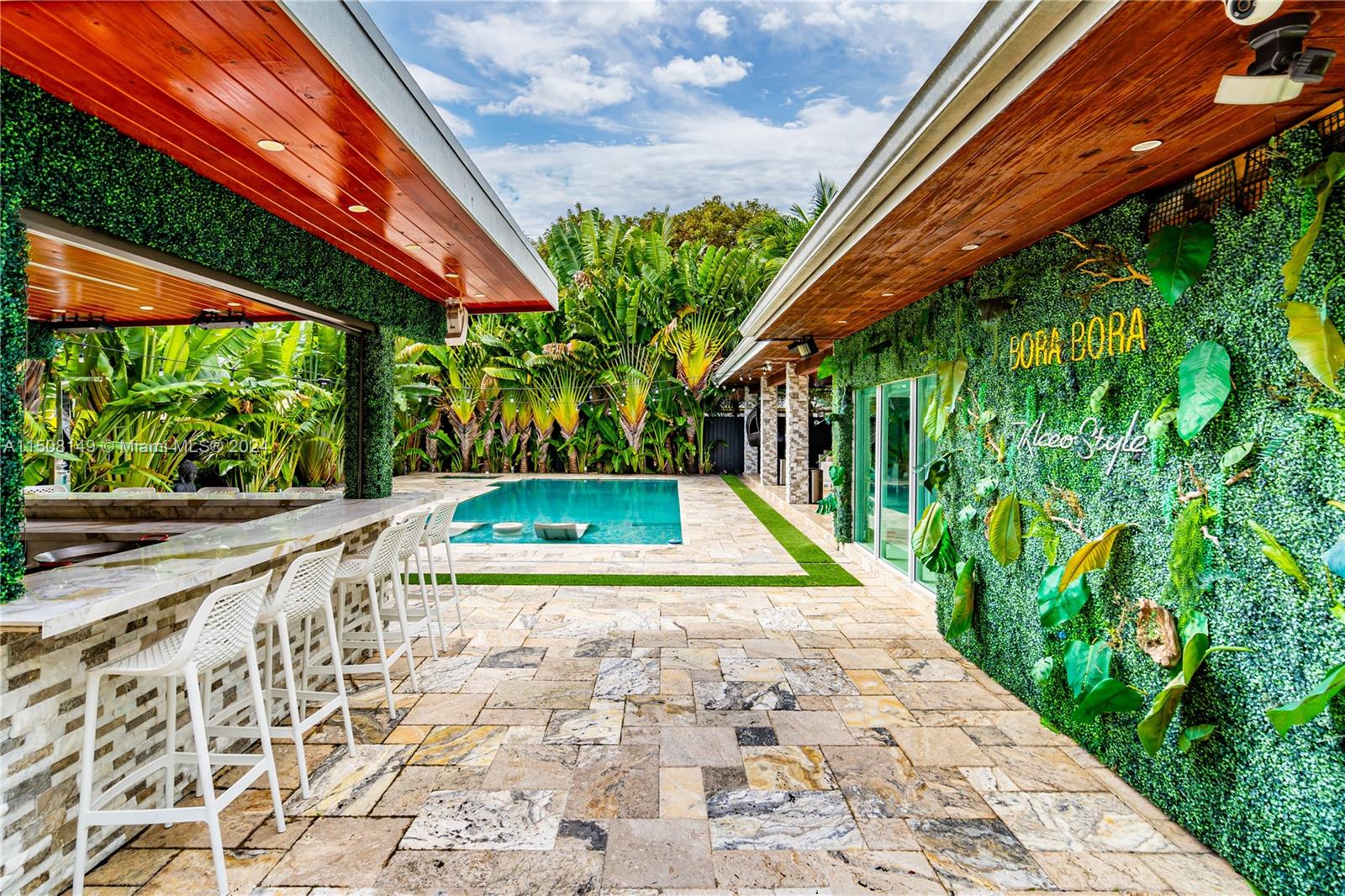 a view of swimming pool with a patio