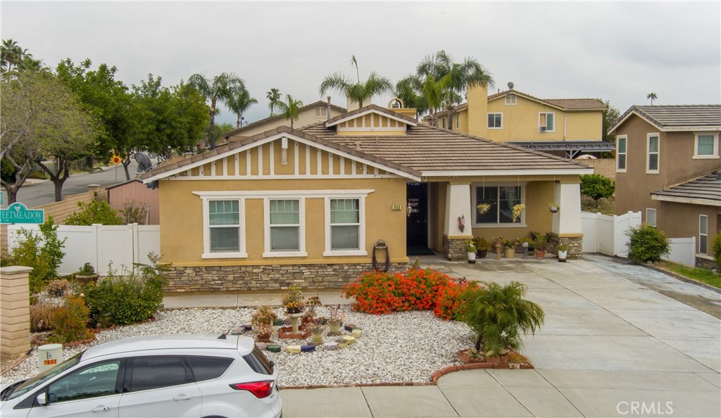 a front view of a house with outdoor seating