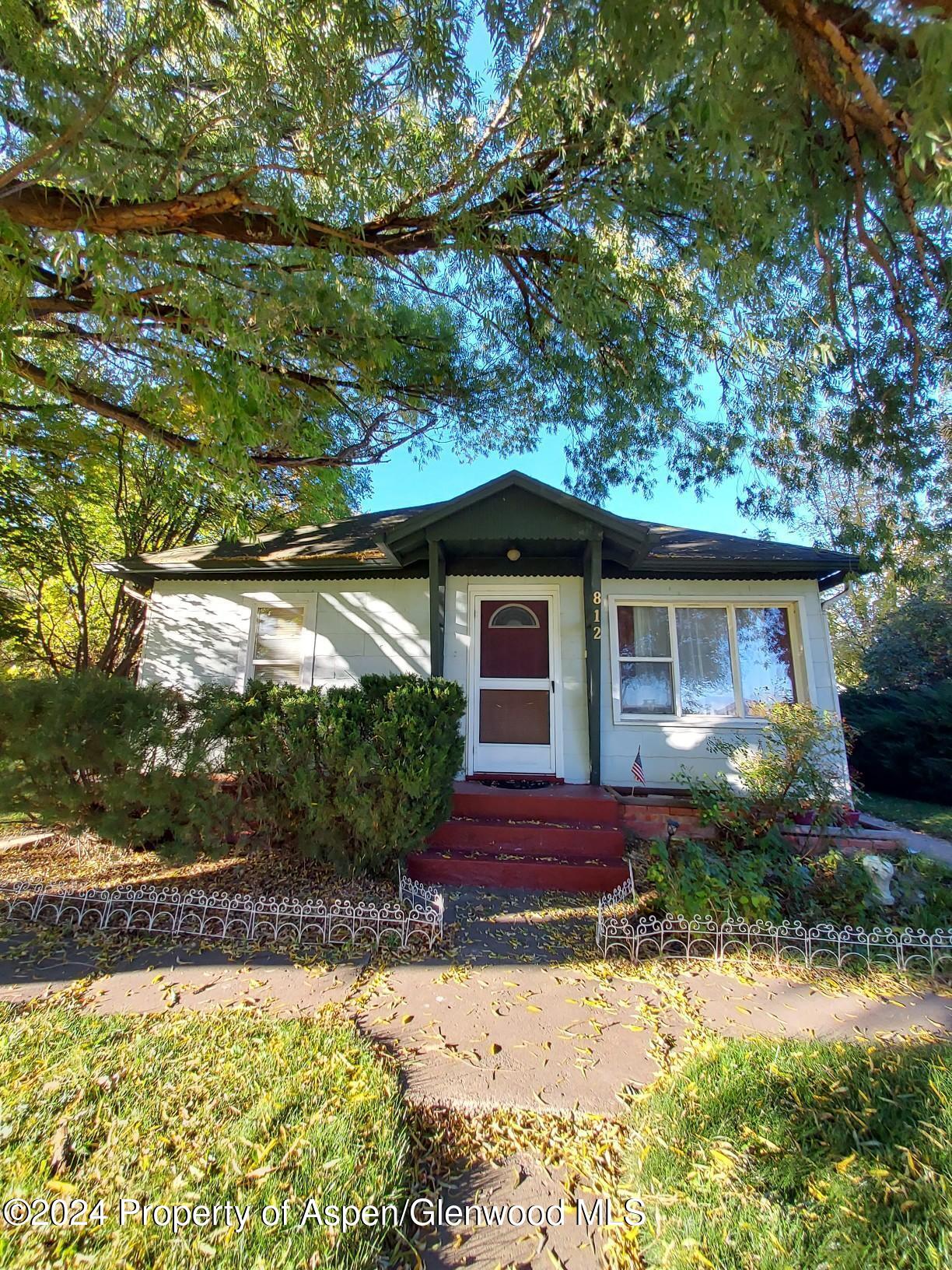 a front view of a house with yard