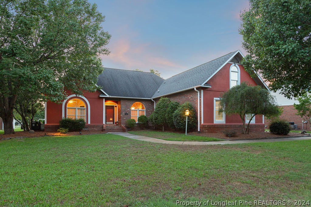 a front view of a house with a yard