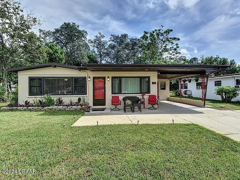 front view of a house with a patio