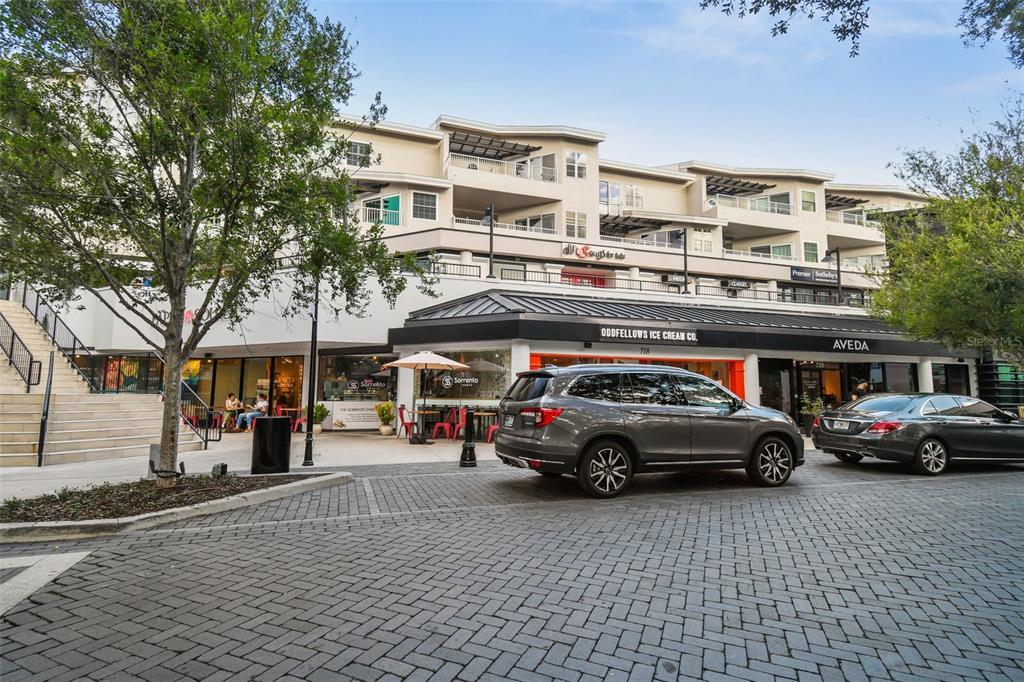 a view of street with parked cars