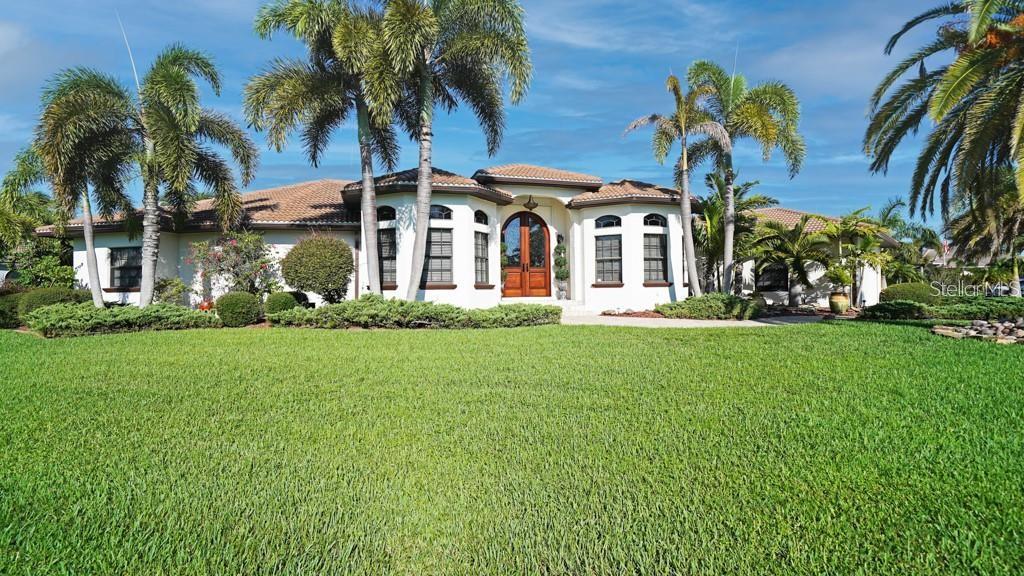 a front view of house with yard and green space