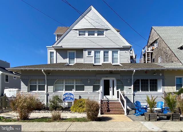 a front view of a house with many windows